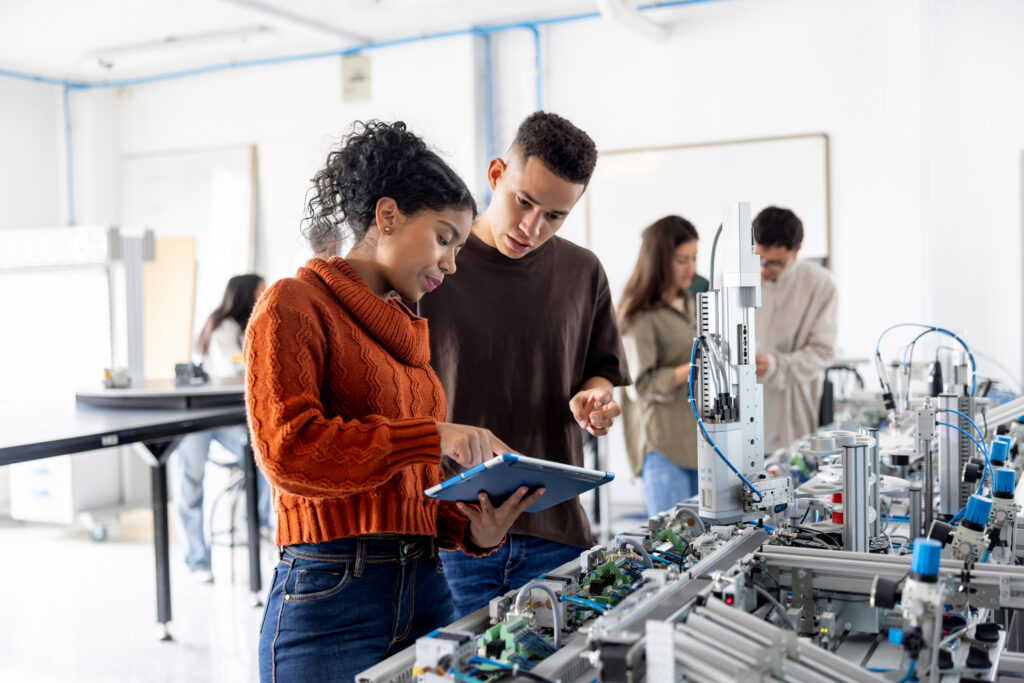 Two colleagues collaborate on a robotics project.