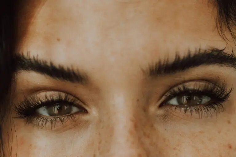 A close up of a woman's brown eyes